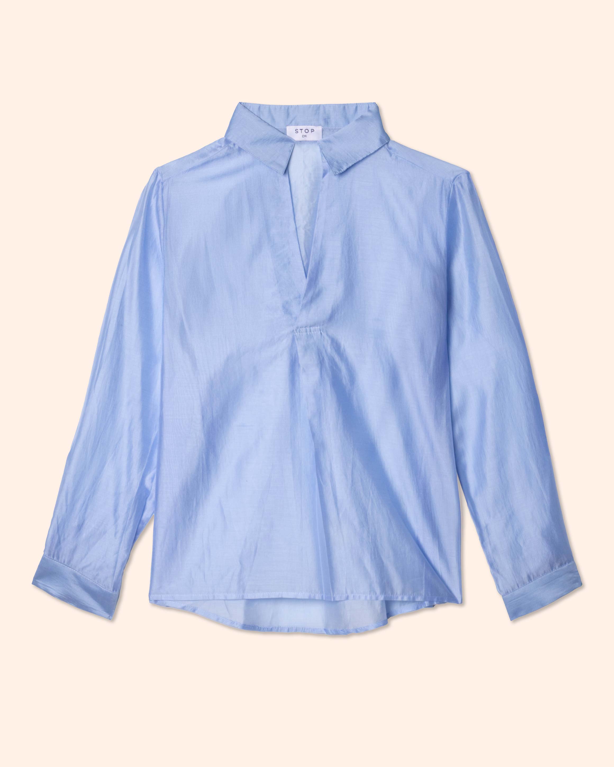 Blusa manga larga, tela ligera con brillo sutil