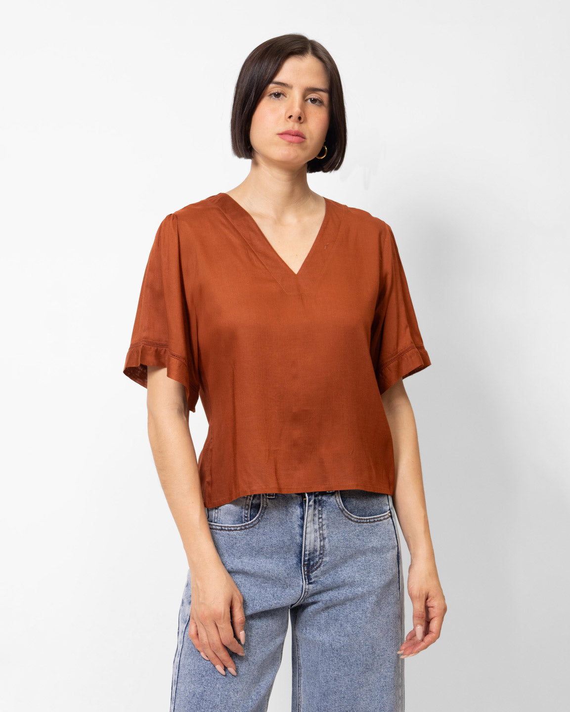 Blusa manga corta con aplicación en puño