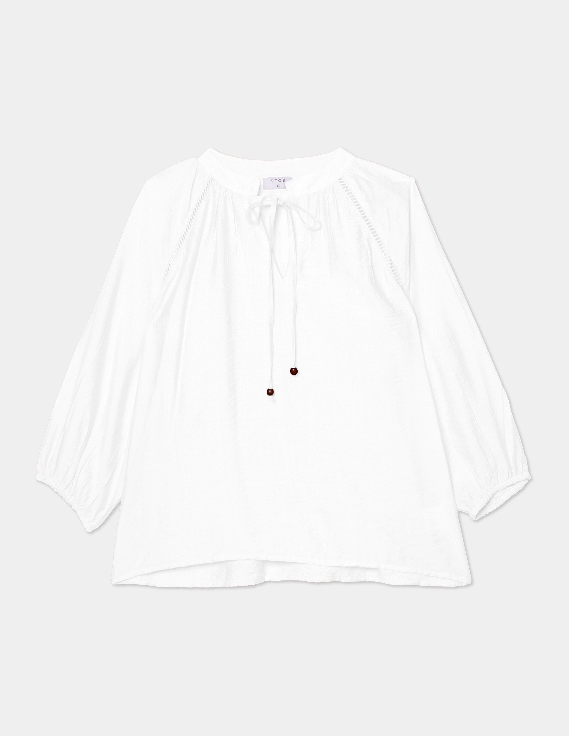 Blusa manga 3/4 con aplicación en hombro