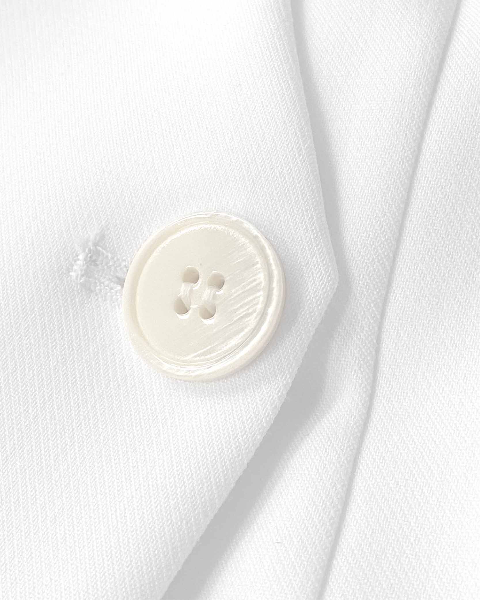 vestido-blanco-sastre-cruce-botones