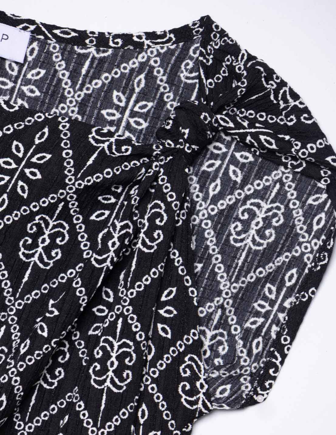 Blusa estampada nudo hombro